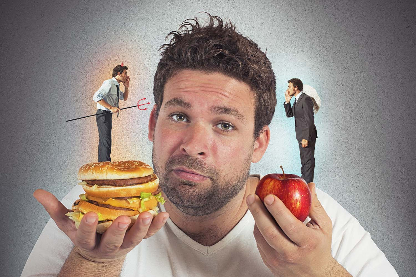 Saddened man holding an apple and a cheeseburger.
